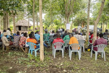 Community members in Pader district, Uganda, take part in a training session on tree planting.